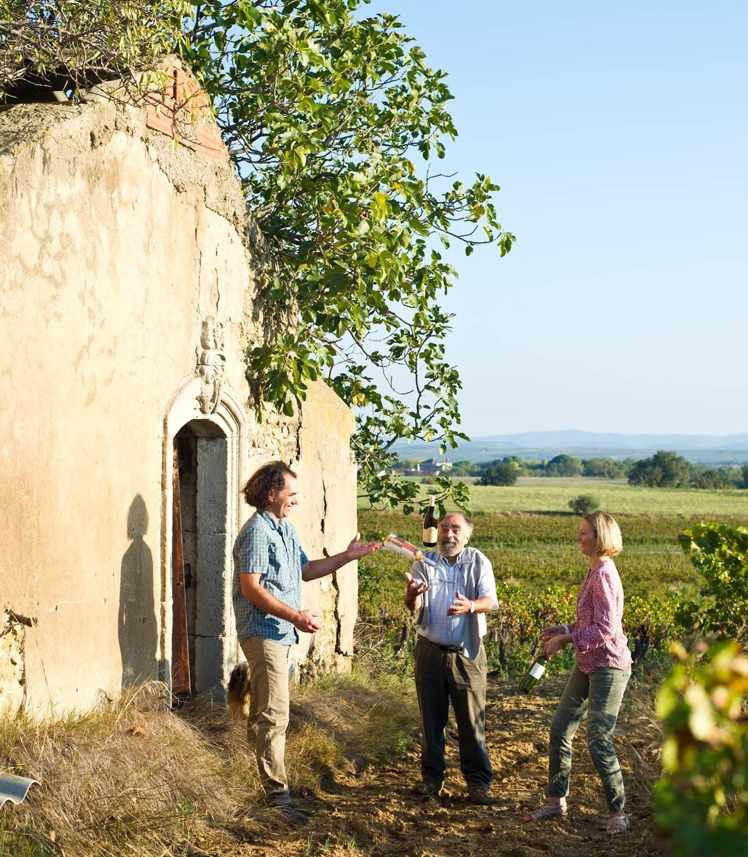 Vineyard owners outside structure walls-1